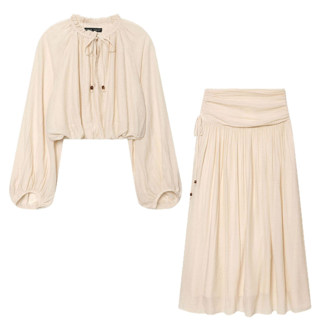 Women's midi skirt with high turnover waistband, fine pleat detailing and wooden button detail Mune Fashion