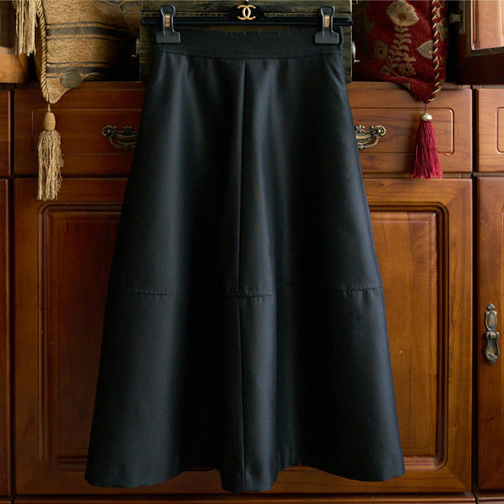 Women's midi skirt made of vegan leather with a high waist and tiered A-line Mune Fashion