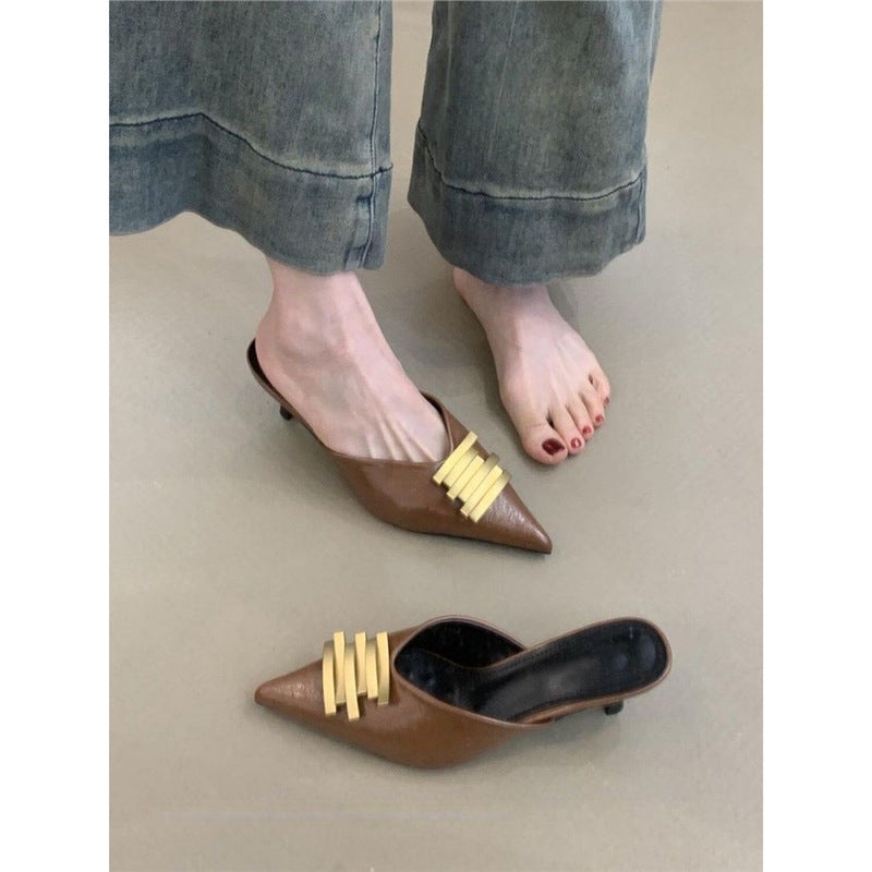 Ladies pointed toe leather look mules with sculpted kitten heel and gold wave appliqué Mune Fashion
