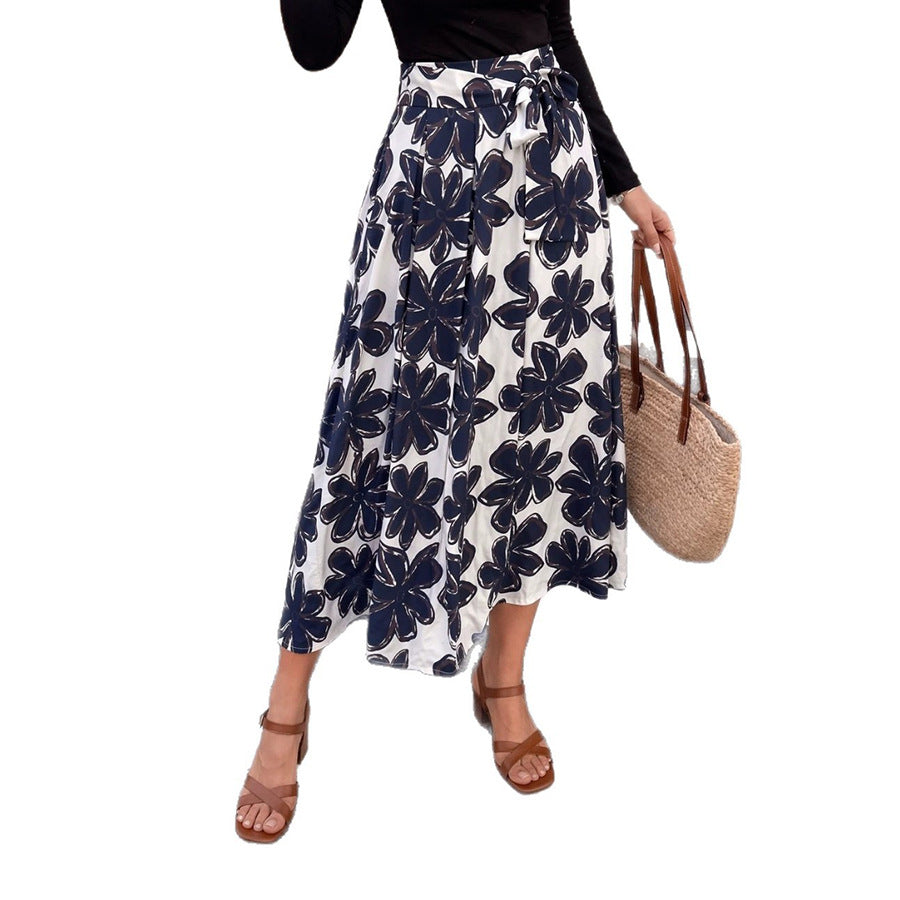 Women's midi skirt in A-line cut with large floral print, high waistband and side pockets Mune Fashion