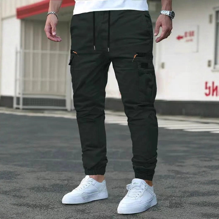 Men's cargo jogging pants with multifunctional zip and flap pockets, elastic waistband & cuffs Mune Fashion