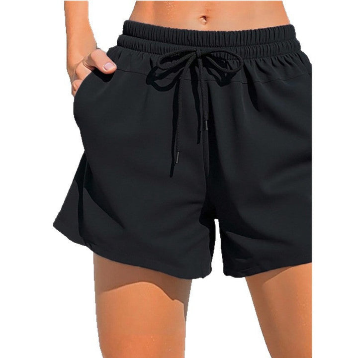 Women's sporty swim shorts with elastic waistband and practical pockets Mune Fashion