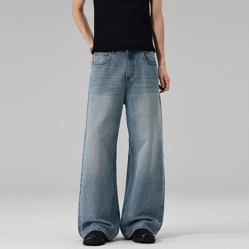 Women Ultra Wide Floor-Length Denim Palazzo Pants with Sculptural Width and Soft Bleach Accents Mune Fashion