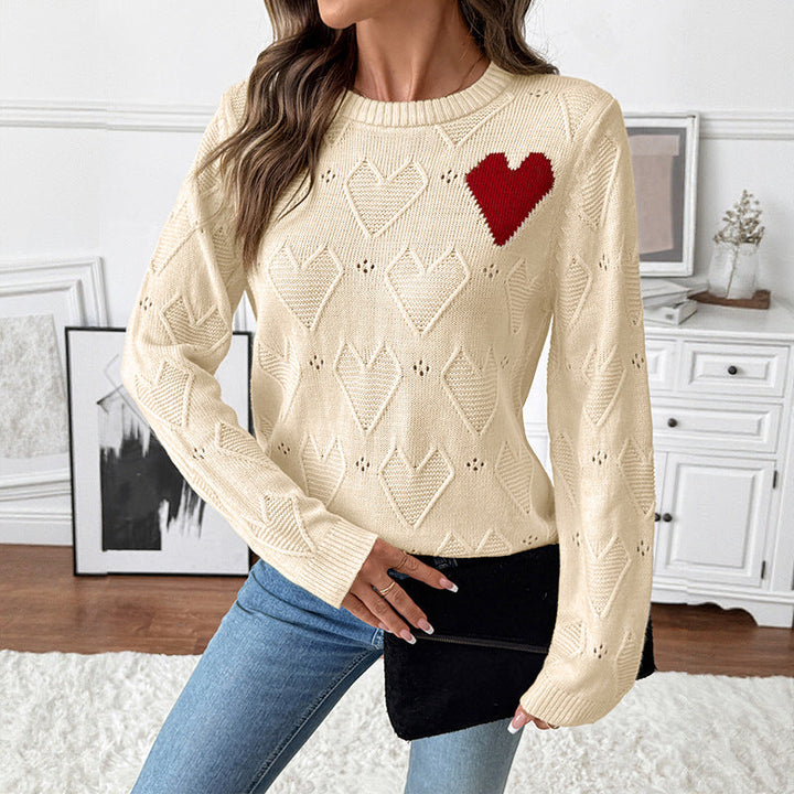 Women's fine knit sweater with openwork heart pattern, applied decorative heart and round neckline