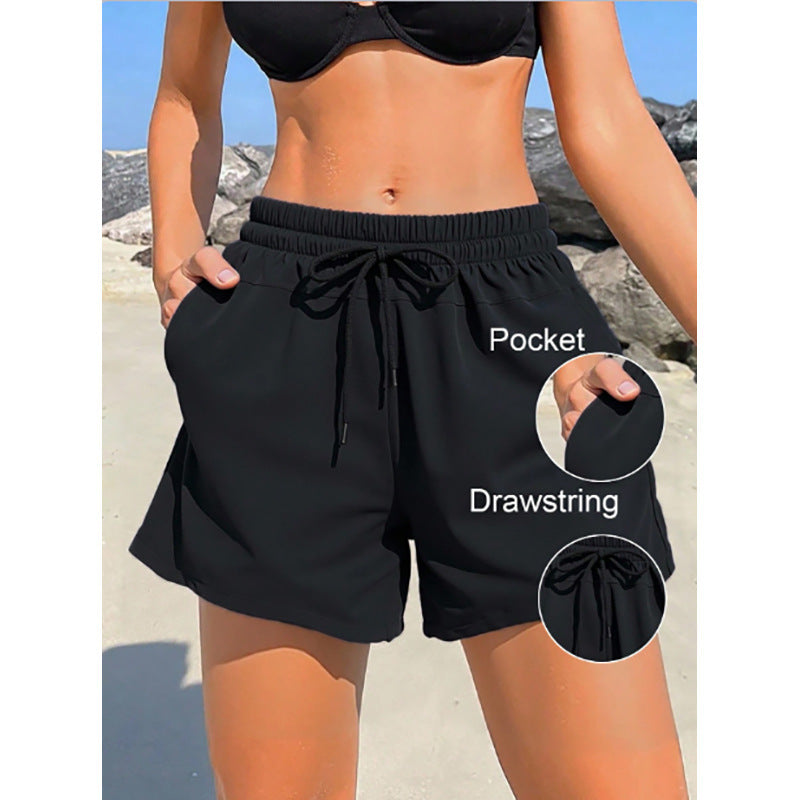 Women's sporty swim shorts with elastic waistband and practical pockets Mune Fashion