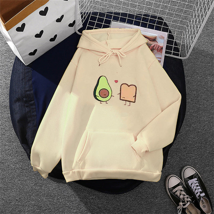 Women's cozy hooded sweatshirt with avocado toast illustration, soft fleece lining, and kangaroo pocket Mune Fashion