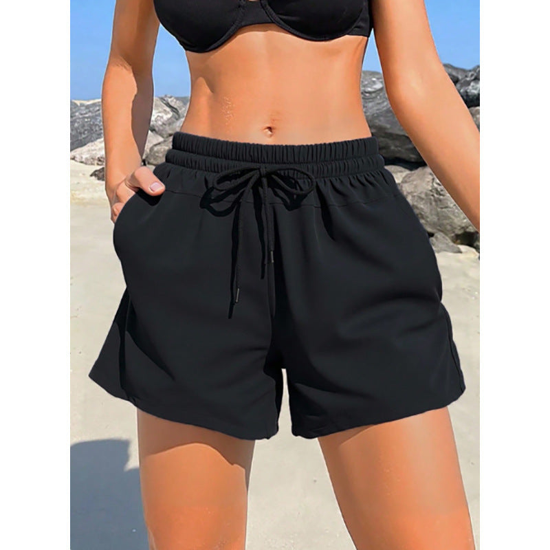 Women's sporty swim shorts with elastic waistband and practical pockets Mune Fashion
