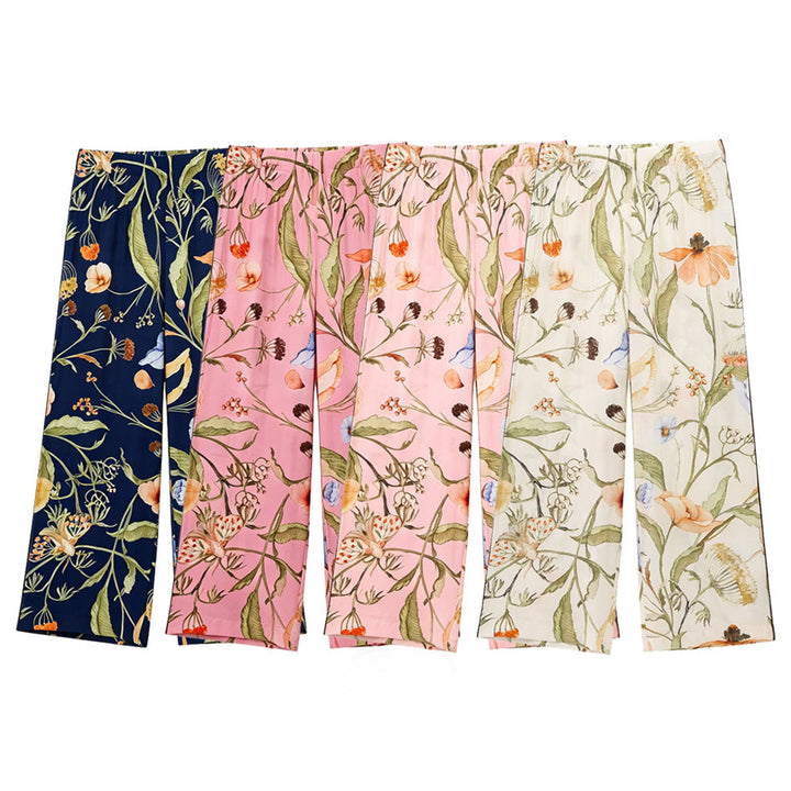 Women's wide high-waisted satin pants with floral all-over print and elastic waistband Mune Fashion