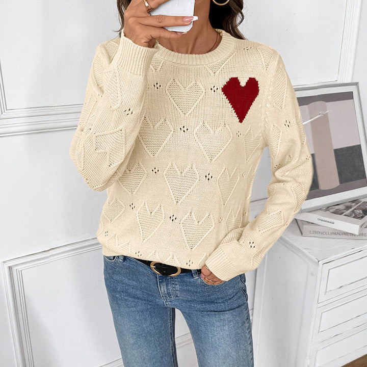 Women's fine knit sweater with openwork heart pattern, applied decorative heart and round neckline