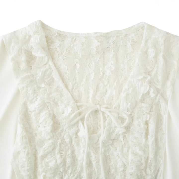 Women's lace blouse with deep V neckline, ruffled front and bell sleeves with tie bands Mune Fashion