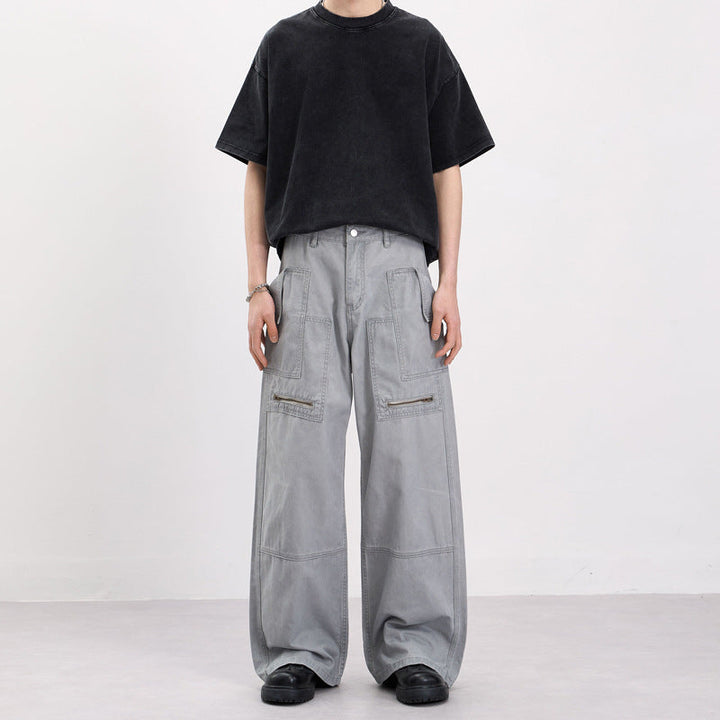 Men's baggy cargo pants in workwear style with large patch pockets and zipper details Mune Fashion